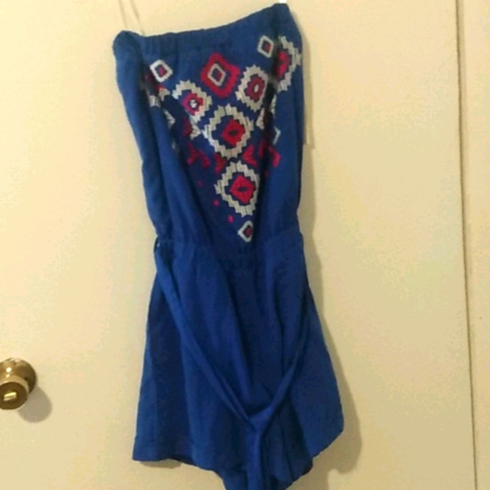 Blue romper with red and white embodiment